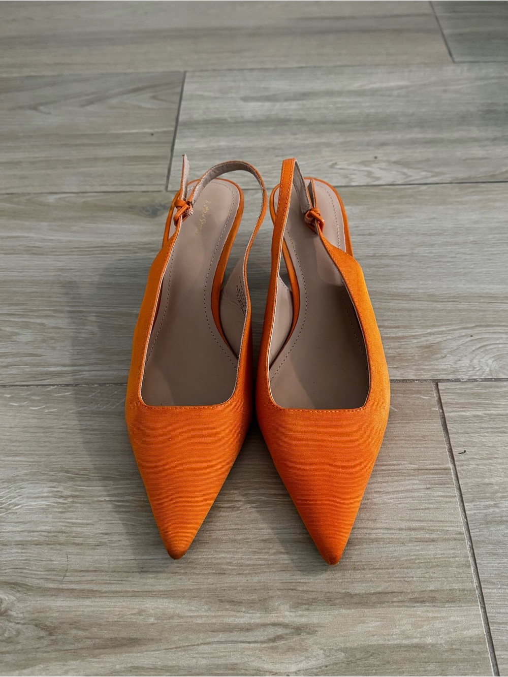 Womenโs Pointed Slingback Flats in Orange
